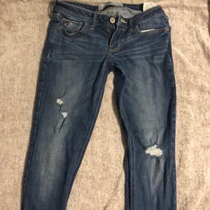 Ripped low rise skinny jeans